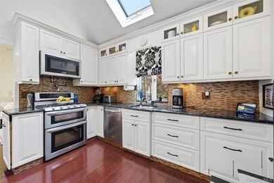 Experience life on the water in this beautifully updated - photo 11