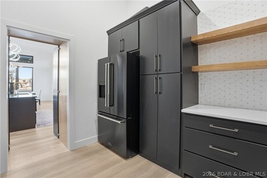 This striking new-construction estate commands panoramic main - photo 12