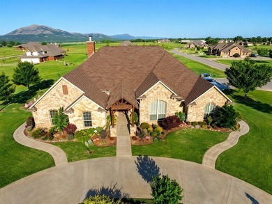 Welcome home to this beautifully maintained custom-built home - photo 1