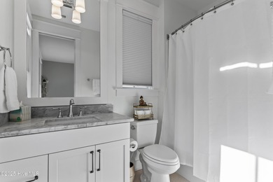 Discover the charm of riverfront living in this stunning