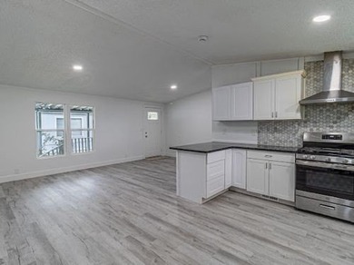 See this gorgeous multi-section home in a desirable park today! - photo 12