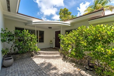 Located on one of Bay Heights' most sought-after streets, this - photo 2