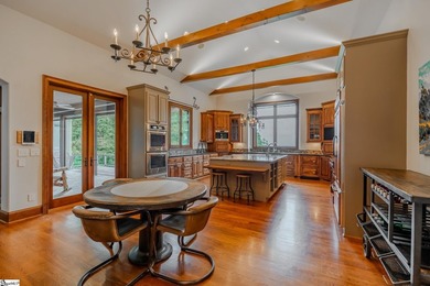 Beneath a vaulted ceiling lined with exposed wood beams and - photo 15