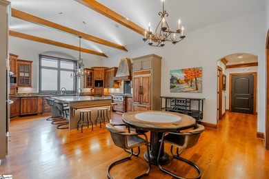 Beneath a vaulted ceiling lined with exposed wood beams and - photo 17