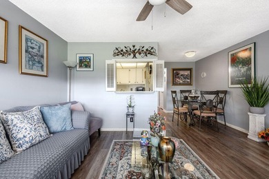 Welcome to this well-maintained second-floor condo in the - photo 2