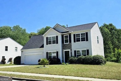 Welcome home to a charming two-story residence nestled in the - photo 1