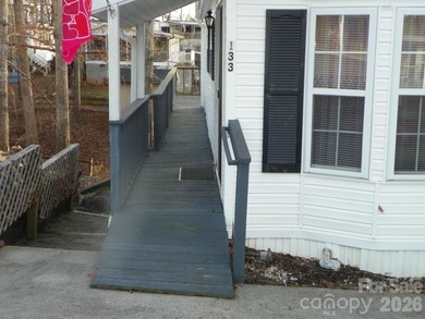 Must see this adorable Park model with full room addition - photo 2
