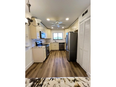 Welcome to this charming 2-bedroom, 2-bathroom condo on the - photo 7
