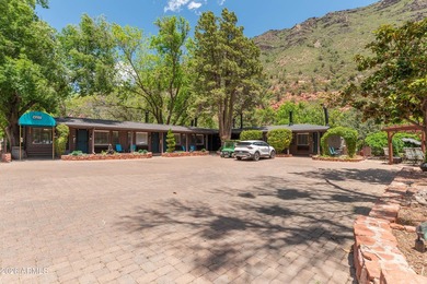 Set beneath the canopy of mature pines and just steps from the - photo 4