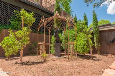 Set beneath the canopy of mature pines and just steps from the - photo 8