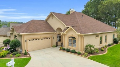 Set on a quiet, non-through street behind the 13th green, this - Lake Home For Sale in Greenwood, South Carolina