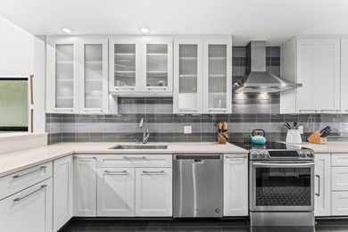 Welcome home to this exceptional, recently renovated upper-floor