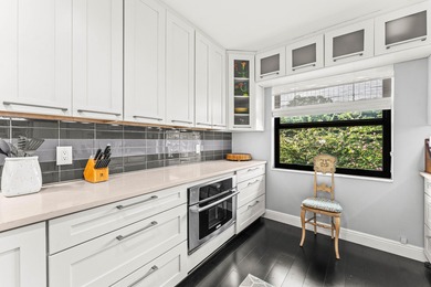 Welcome home to this exceptional, recently renovated upper-floor