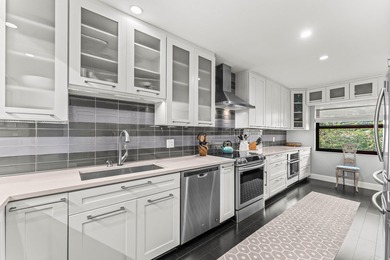 Welcome home to this exceptional, recently renovated upper-floor