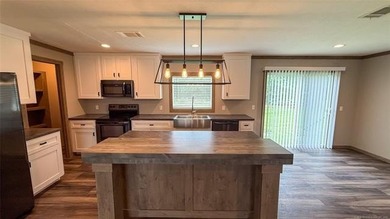 Move-in ready home with an incredible 50'x100' insulated shop on - photo 21
