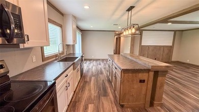 Move-in ready home with an incredible 50'x100' insulated shop on - photo 27