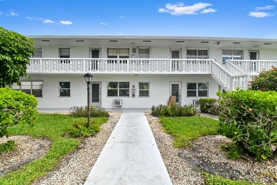 Welcome to this charming 1-bedroom, 1.5-bathroom corner-unit - photo 1