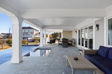 Set on 175 feet of private sandy beachfront with a 136' dock - photo 14