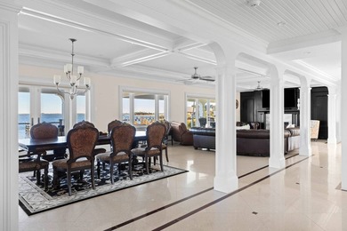 Set on 175 feet of private sandy beachfront with a 136' dock - photo 15