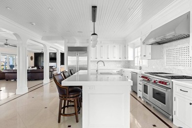 Set on 175 feet of private sandy beachfront with a 136' dock - photo 19