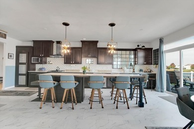 Light-filled and spacious, this open floor plan features vaulted - photo 15