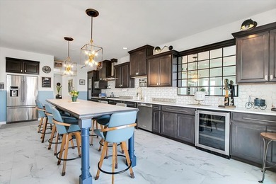 Light-filled and spacious, this open floor plan features vaulted - photo 17