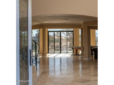Nestled on the 4th fairway in RESIDENTIAL ESTATES, this stunning - photo 6