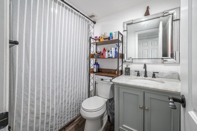 Updated first-floor condo with stunning lake views & abundant - photo 10