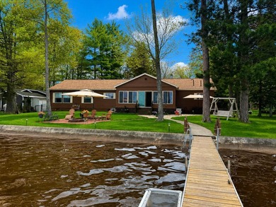 Experience stunning lakefront living in this spacious 4-bedroom - photo 1