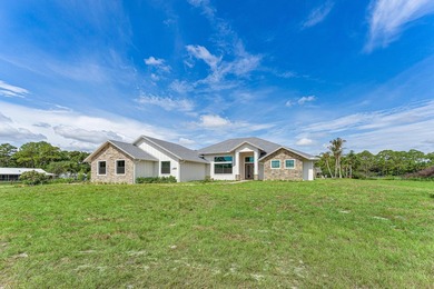 Welcome to 16631 132nd Terrace North, a newly completed custom - photo 3