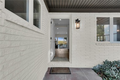 Perched on deep water along Richardson Creek, this reimagined - photo 9