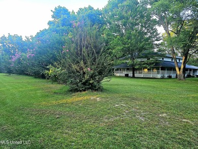 2 acre corner lot with wraparound porch. **USDA Eligible** 4 - photo 6