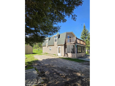 Escape to Northern Michigan with this inviting riverfront - photo 2