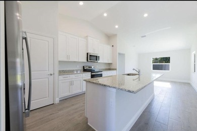 Beautiful 2022 CBS home featuring 4 bedrooms, 2 bathrooms, and a - photo 4
