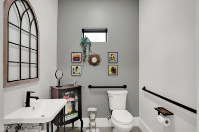 This exceptional 2-year-old barndominium offers modern country