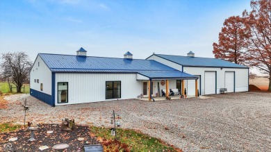 This exceptional 2-year-old barndominium offers modern country