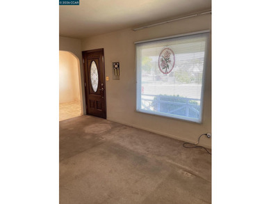 A newer stylish front door, dual paned windows, compliant gas - photo 3
