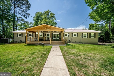 This 3 BR/3 BA home is on a spectacular oversized Mid Cove *Wide - Lake Home For Sale in Eatonton, Georgia