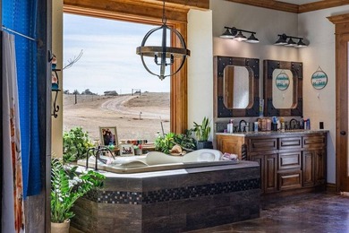 Nestled on a sprawling 550-acre estate, this extraordinary - photo 4