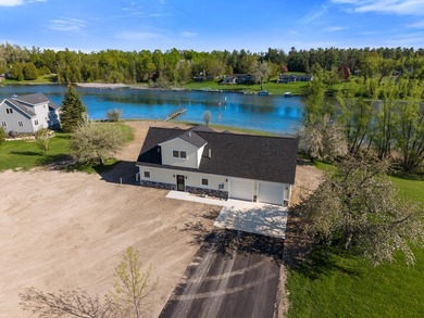 Brand new construction on the beautiful Cheboygan River! Enjoy - photo 3