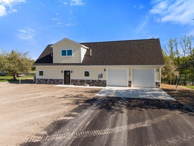 Brand new construction on the beautiful Cheboygan River! Enjoy - photo 6