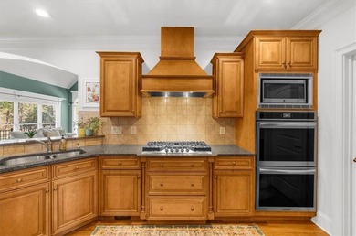 Set within the gated enclave of North Gate Manor, a sought-after - photo 12
