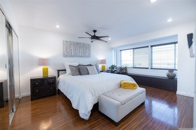 Perched high above the ocean in coveted Waialae Iki, this - photo 11