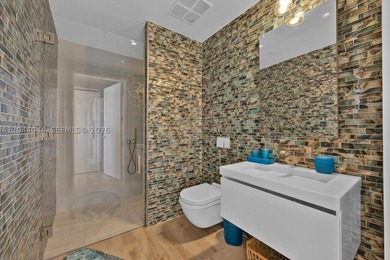 Experience the pinnacle of beachfront luxury with this - photo 12