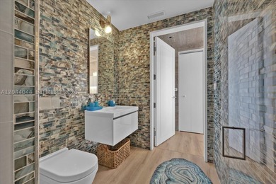 Experience the pinnacle of beachfront luxury with this - photo 13