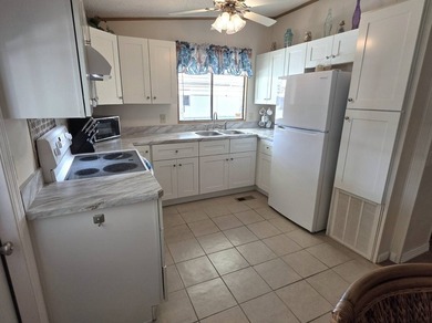 THIS HOME IS ON LEASED LAND WITH A MONTHLY LOT RENT OF $721 AND - photo 12