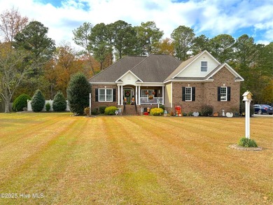 Now available is this stately brick home located in the - photo 1
