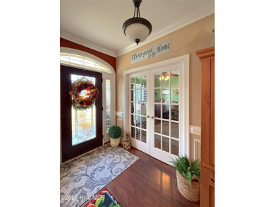 Now available is this stately brick home located in the - photo 4