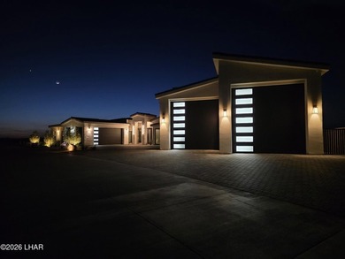 This newly constructed, single-story residence in the exclusive - photo 2