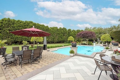 Set behind layers of mature landscaping and sculpted hedges - photo 16